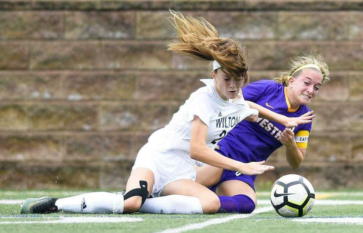 Shelby Dejana (left) battles a Westhill player for the ball during a game last year.
