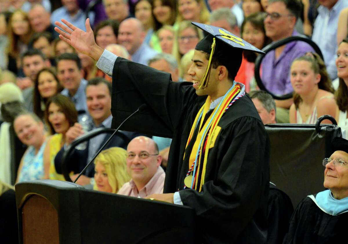 Graduate and Class Valedictorian Manan Manchanda jokingly asks the audience to applaud after every sentence during his address at Trumbull High School's Commencement Exercises in Trumbull, Conn., on Tuesday June 18, 2019.