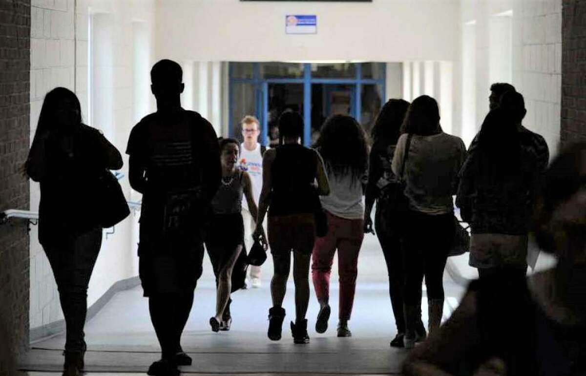 Students in the hallways between classes at Danbury High School.