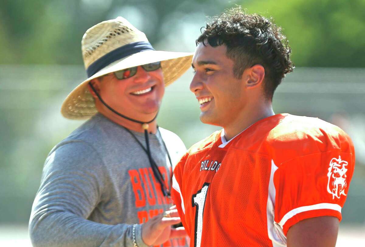 Head coach Phil Barron talks with running back Matthew Salazar. Burbank on the first day of contact drills. Burbank coach Phil Barron. Burbank's top returning players include running back Matthew Salazar and safety Jose Flores on Saturday, August 10, 2019