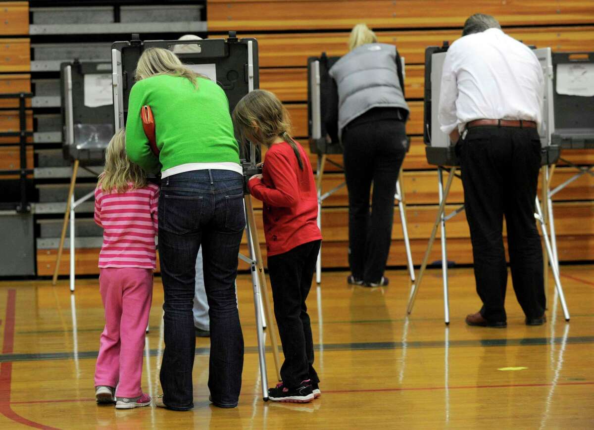 The Yanity Gym, the district three polling place in Ridgefield, Conn., had a steady stream of voters Tuesday, Nov. 4, 2014.