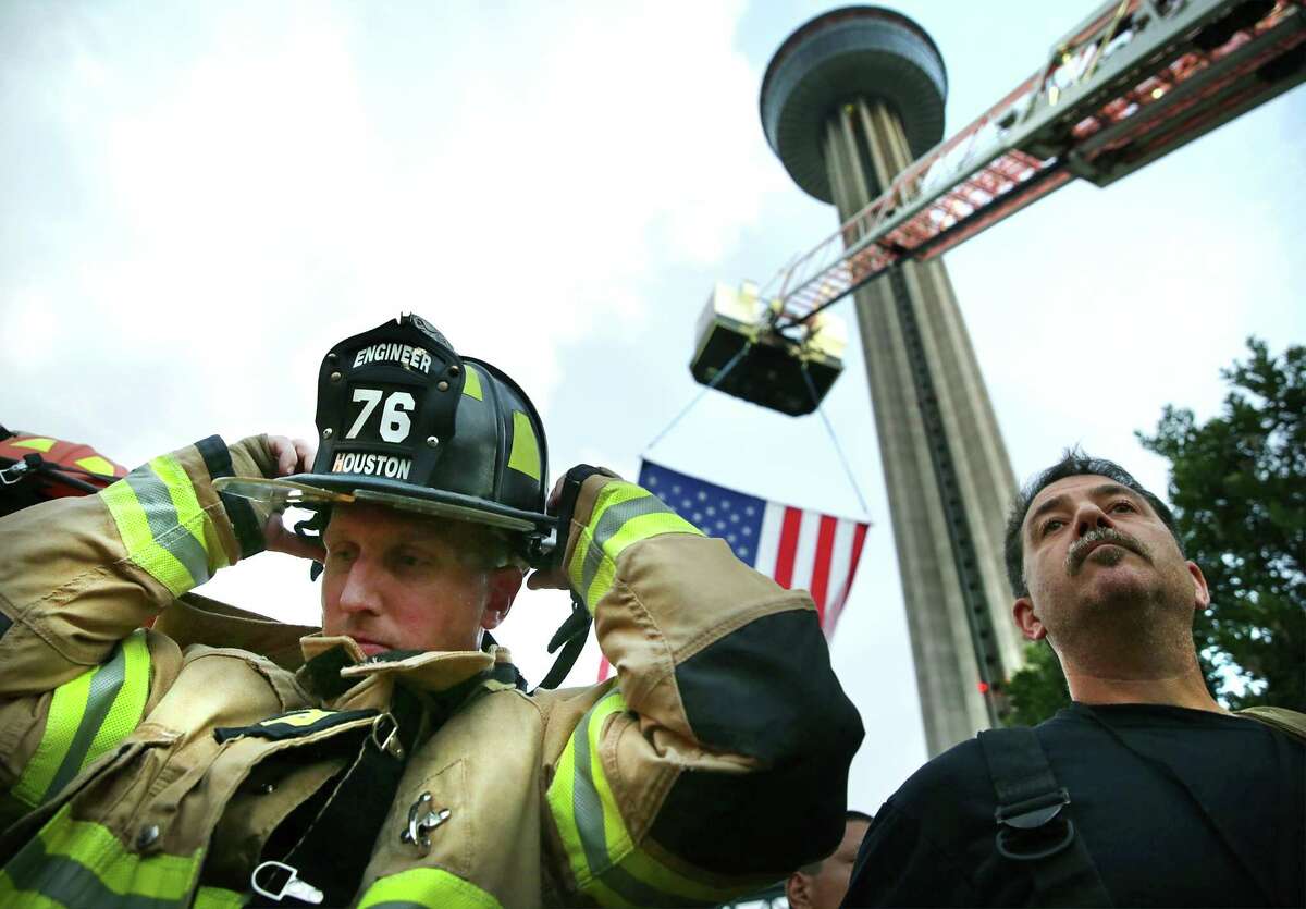 A firefighter from Houston Fire Department prepares to climb the Tower of Americas.