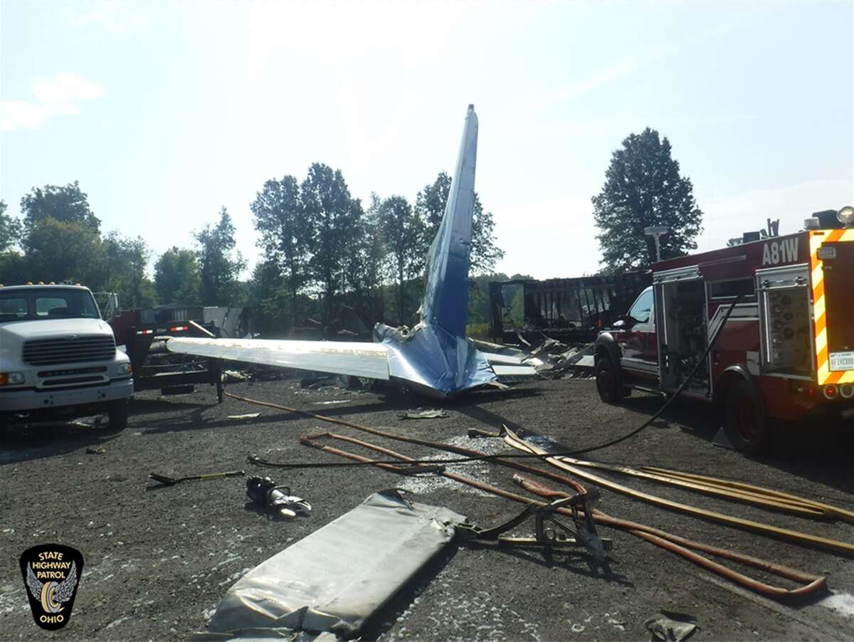 The wreckage from a small cargo plane crash at an auto repair business near Toledo Express Airport Wednesday, Sept. 11, 20129, in Monclova, Ohio.