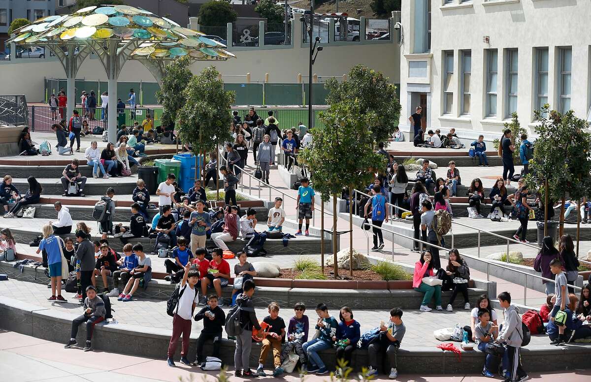Students at Presidio Middle School congregate in the newly renovated schoolyard during the lunch break in San Francisco, Calif. on Tuesday, Sept. 10, 2019. Salesforce provided funds to refurbish and upgrade the schoolyard and library.