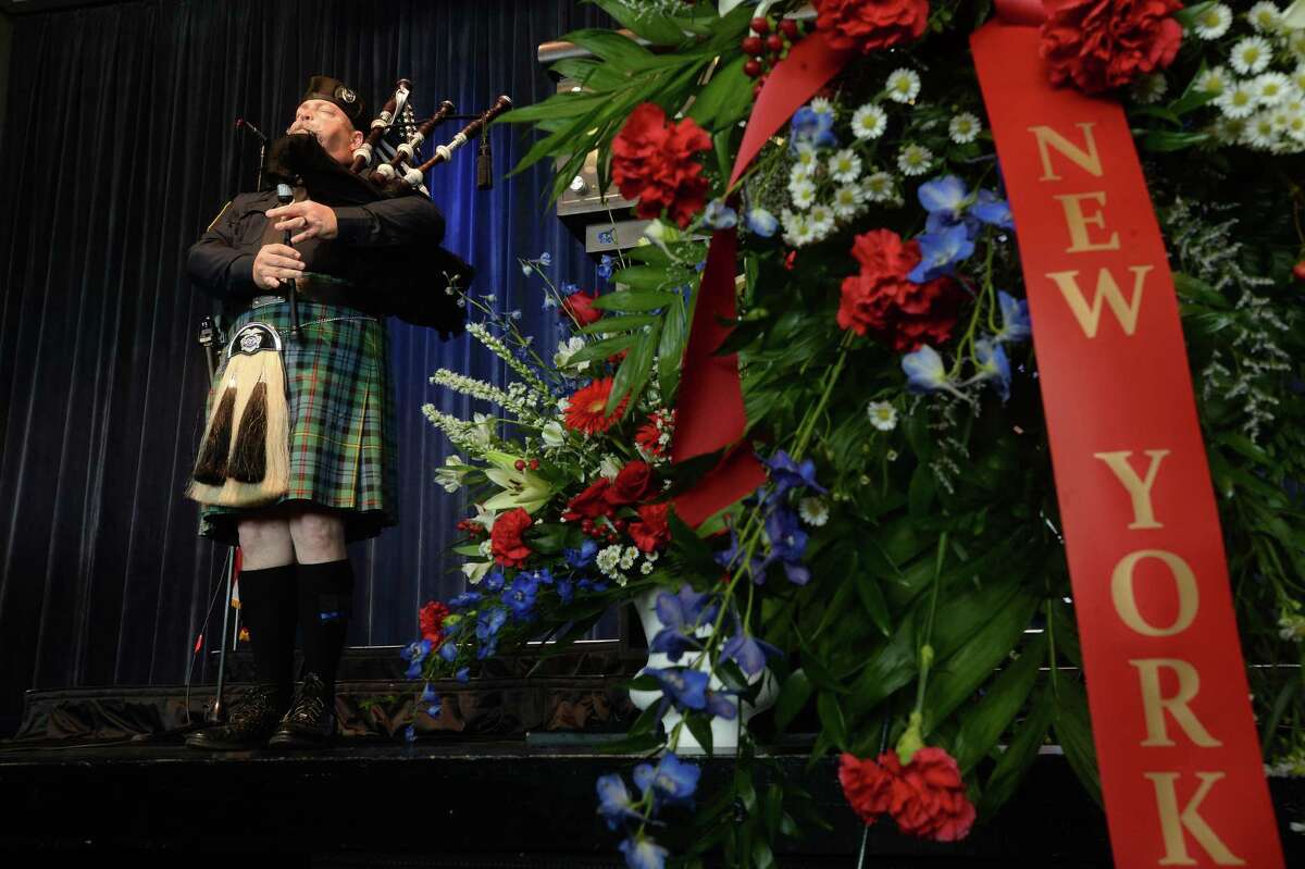 Officer Jeff Courts performs "Amazing Grace" on the bagpipes during the City of Beaumont's 2019 Patriot Day Commemoration Ceremony at the Event Centre Wednesday. The event honored first responders throughout the region and nation, and remembered those who served and were killed during the terrorist attacks Sep. 11, 2001. Emergency responders and various members of the community, including choirs from Beaumont United and West Brook High Schools gathered to observe and join in the event, which was followed by a luncheon for first responders. Lt. Colonel Skylor D. Hearn, who began his law enforcement career with the Beaumont Police Department in 1992 and currently serves as a Deputy Director for the Texas Department of Public Safety, was the keynote speaker. Photo taken Wednesday, September 11, 2019 Kim Brent/The Enterprise