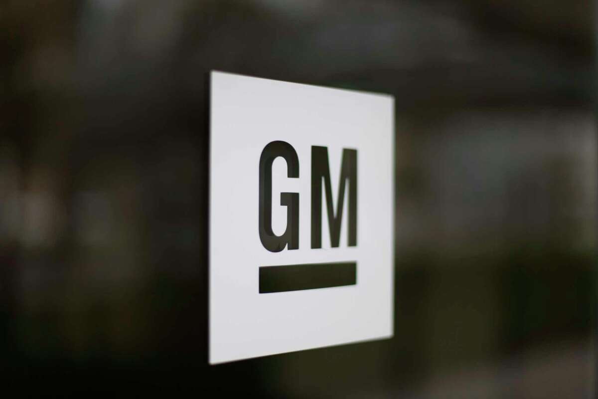 FILE - This May 16, 2014, file photo, shows the General Motors logo at the company's world headquarters in Detroit. Under pressure from the federal government, General Motors is recalling more than 3.4 million big pickup trucks and SUVs in the U.S to fix a brake problem. The recall covers the Chevrolet Silverado and GMC Sierra 1500, 2500 and 3500 pickups from the 2014 through 2018 model years. GM says a pump in the power-assist brakes can put out less vacuum than needed, increasing stopping distance and the risk of a crash. (AP Photo/Paul Sancya, File)