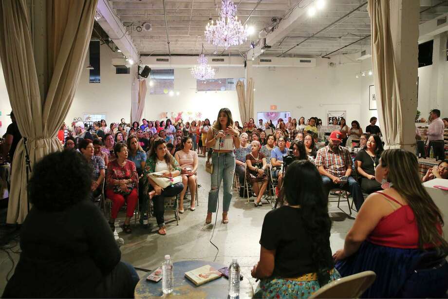 An audience member asks a question during a question-and-answer session with Melanie Mendez-Gonzales of "Que Means What"; Cristina Martinez of "Very That," a local Chicana-owned brand of merchandise with a big online following; and author Kathy Cano-Murillo, creator of The Crafty Chica. (Kin Man Hui/San Antonio Express-News) Photo: Kin Man Hui, Staff Photographer / ©2019 San Antonio Express-News