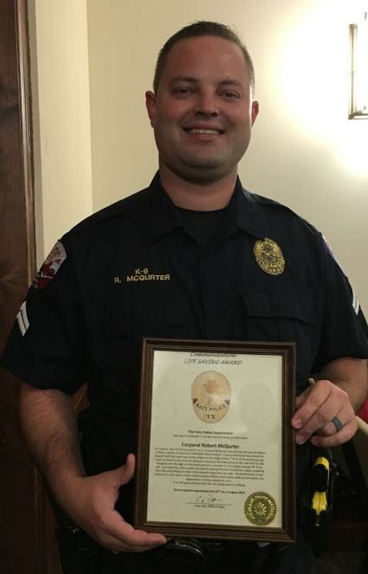 Corporal Robert McQurter of the Katy Police Department received a life-saving award at the Aug. 26 Katy City Council meeting from Police Chief Noe Diaz.