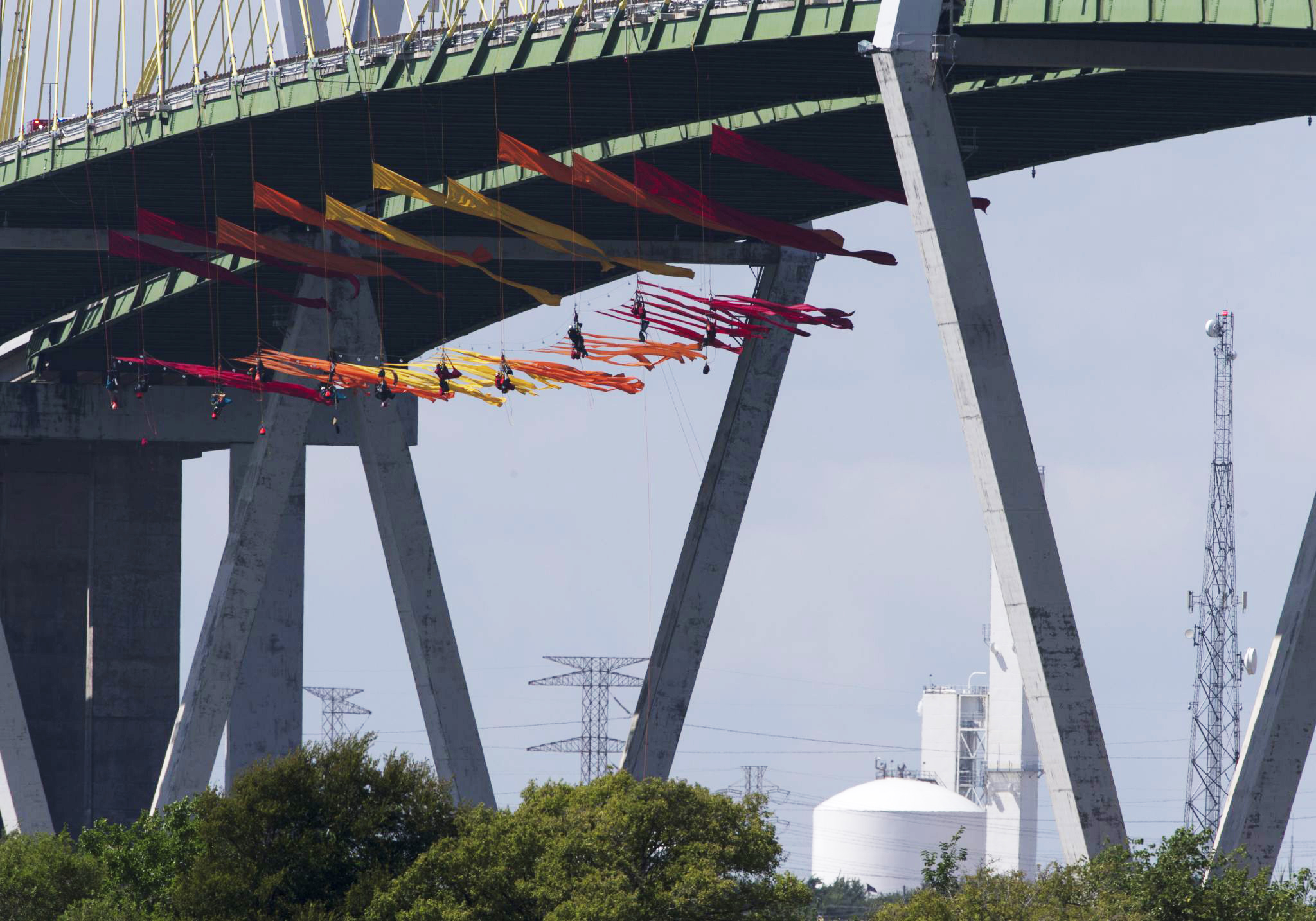 Greenpeace protesters climb Fred Hartman bridge ahead of Democratic debate