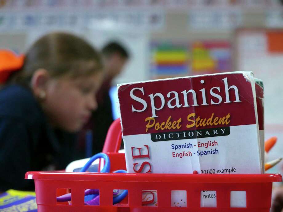 Maya Rodriguez, then a third grader, studies Spanish at Mark Twain Dual Language Academy. Two years ago, Twain switched from being a middle school to being the first traditional public school in San Antonio that offers only dual language classes. Photo: Billy Calzada / San Antonio Express-News