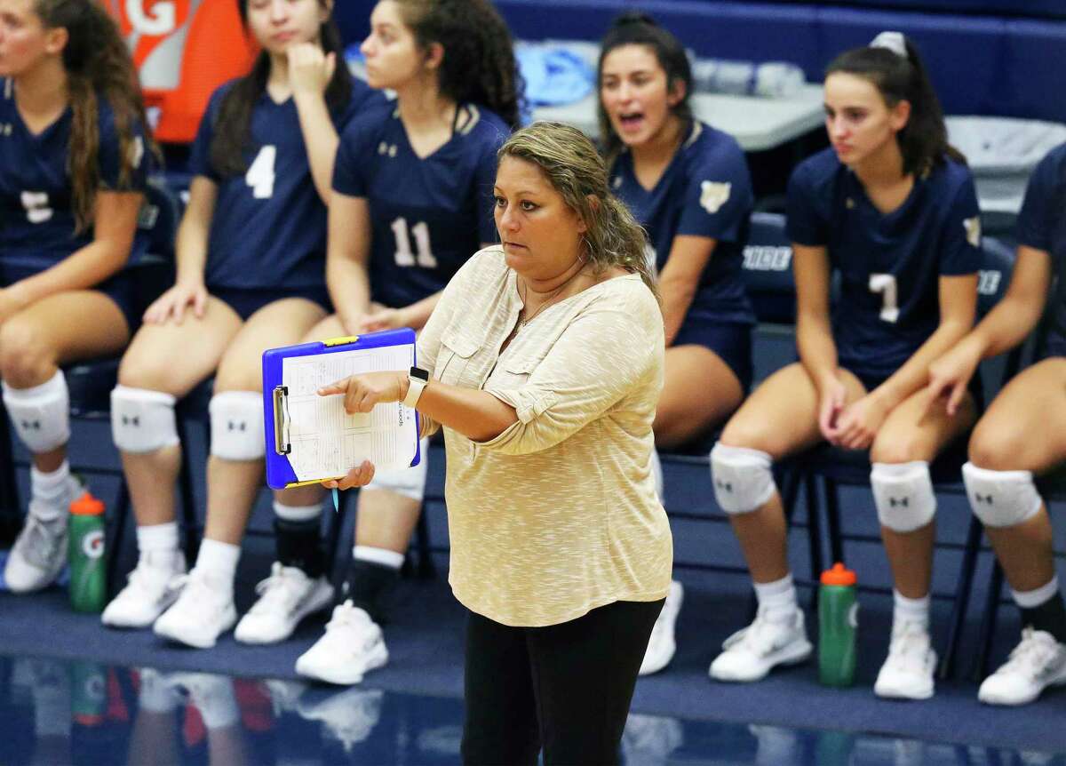 Panther coach Yami Garcia signals from the sideline as Harlan plays O'Connor at Taylor Field House on August 120, 2019.