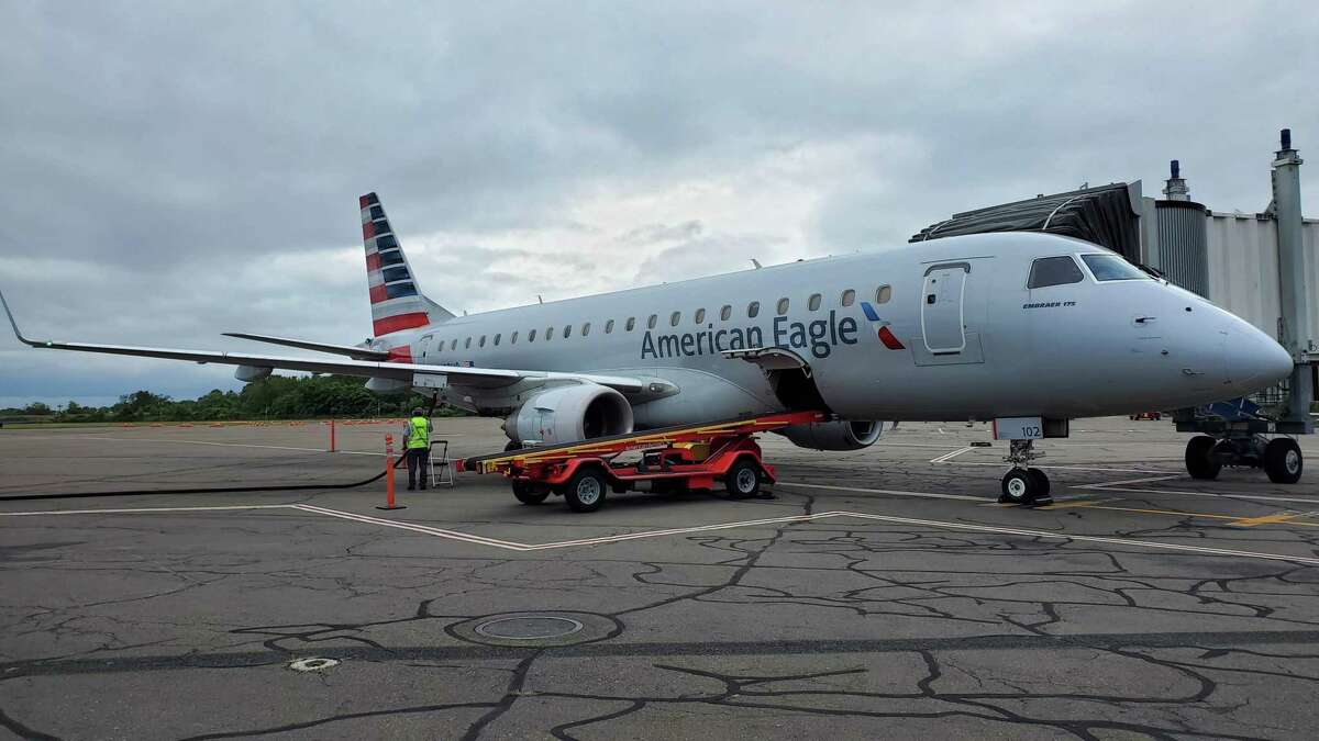 An American Eagle Embraer E175 regional jet, just arrived from Philadelphia, parked on the tarmac at Tweed New Haven Regional Airport in September 2019.