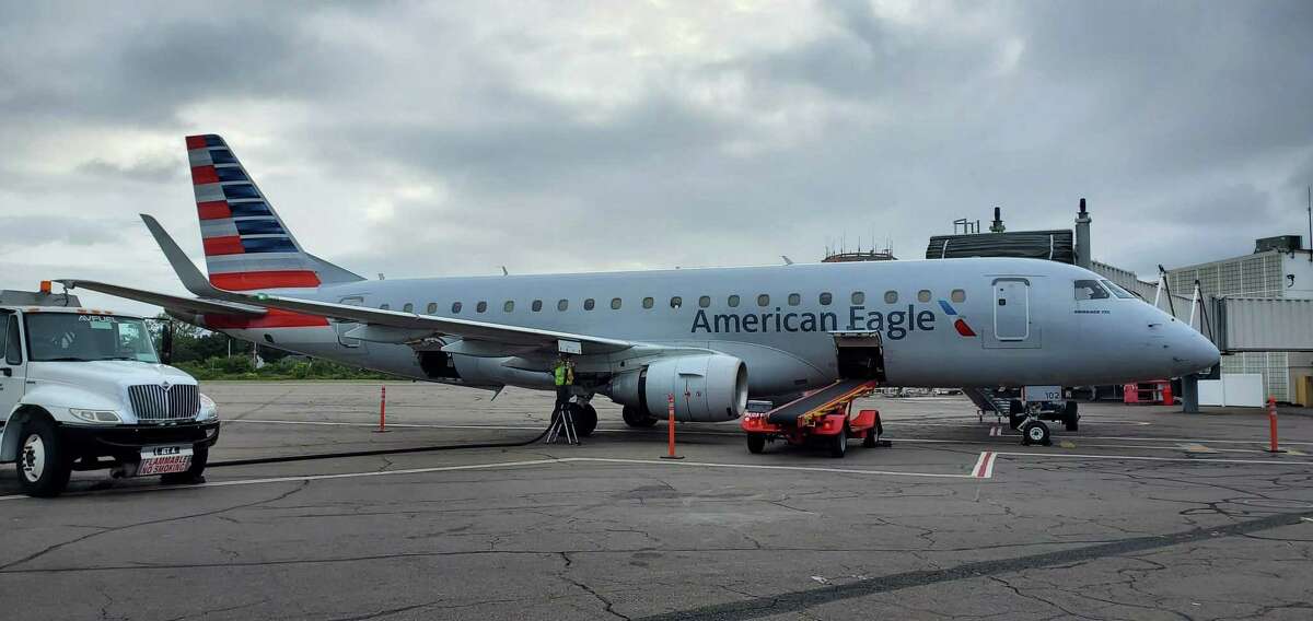 An American Eagle Embraer E175 regional jet, just arrived from Philadelphia, parked on the tarmac at Tweed New Haven Regional Airport.on Thursday afternoon, Sept. 12, 2019. American recently upgraded to the 76-seat planes, which bring First Class service back to Tweed for the first time since 1995.