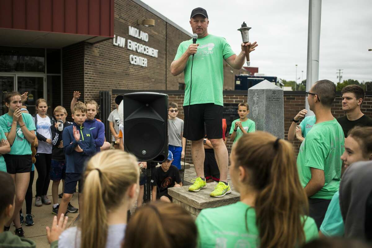 Rodney Roten addresses a crowd of runners and walkers before the Law Enforcement Torch Run Thursday, Sept. 12, 2019 at the Midland Law Enforcement Center. (Katy Kildee/kkildee@mdn.net)