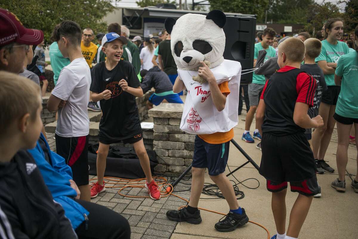 Runners and walkers gather before participating in the Law Enforcement Torch Run Thursday, Sept. 12, 2019 at the Midland Law Enforcement Center. (Katy Kildee/kkildee@mdn.net)