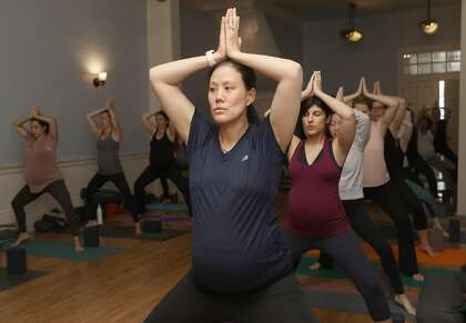 A prenatal yoga class takes place at Yoga Tree on Friday, Sept. 6, 2019 in San Francisco, Calif.