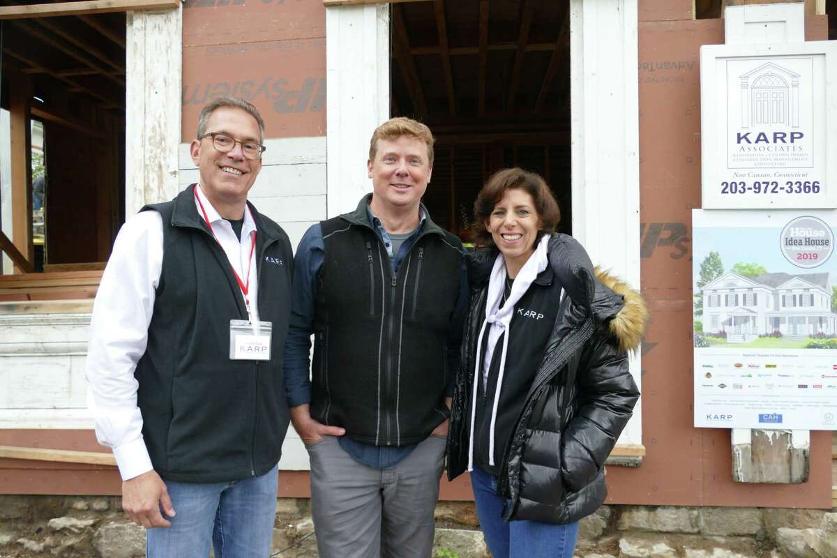 This Old House host Kevin O'Connor stood in between Developer Arnold Karp and Robin Carroll, project manager for Karp Associates on Tuesday May 16, on Main St. in New Canaan.