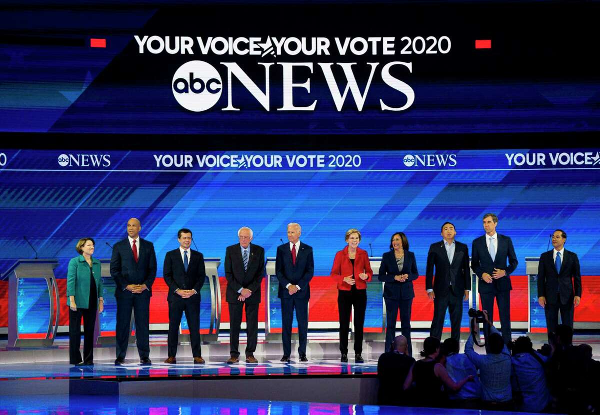 The Democratic presidential candidates line up before beginning the Democratic presidential debate inside Texas Southern University's Health & PE Arena in Houston, Thursday, Sept. 12, 2019.