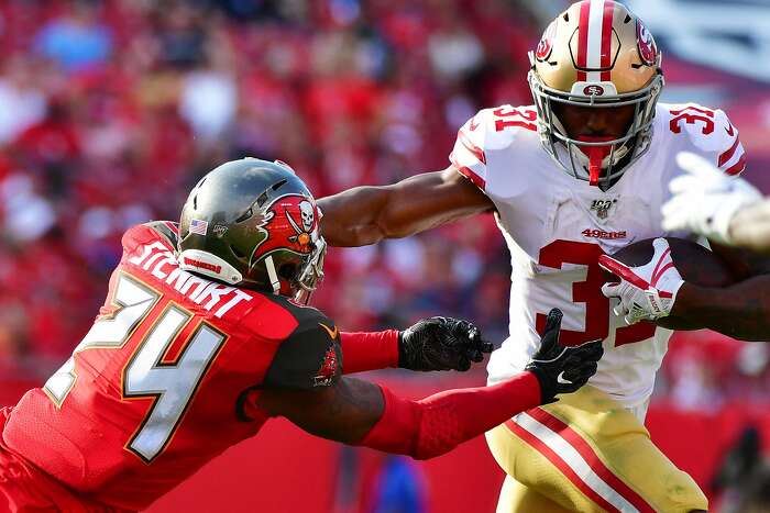 San Francisco 49ers safety Tarvarius Moore (33) tackles Kansas City Chiefs  wide receiver JuJu Smith-Schuster during an NFL football game in Santa  Clara, Calif., Sunday, Oct. 23, 2022. (AP Photo/Godofredo A. Vásquez