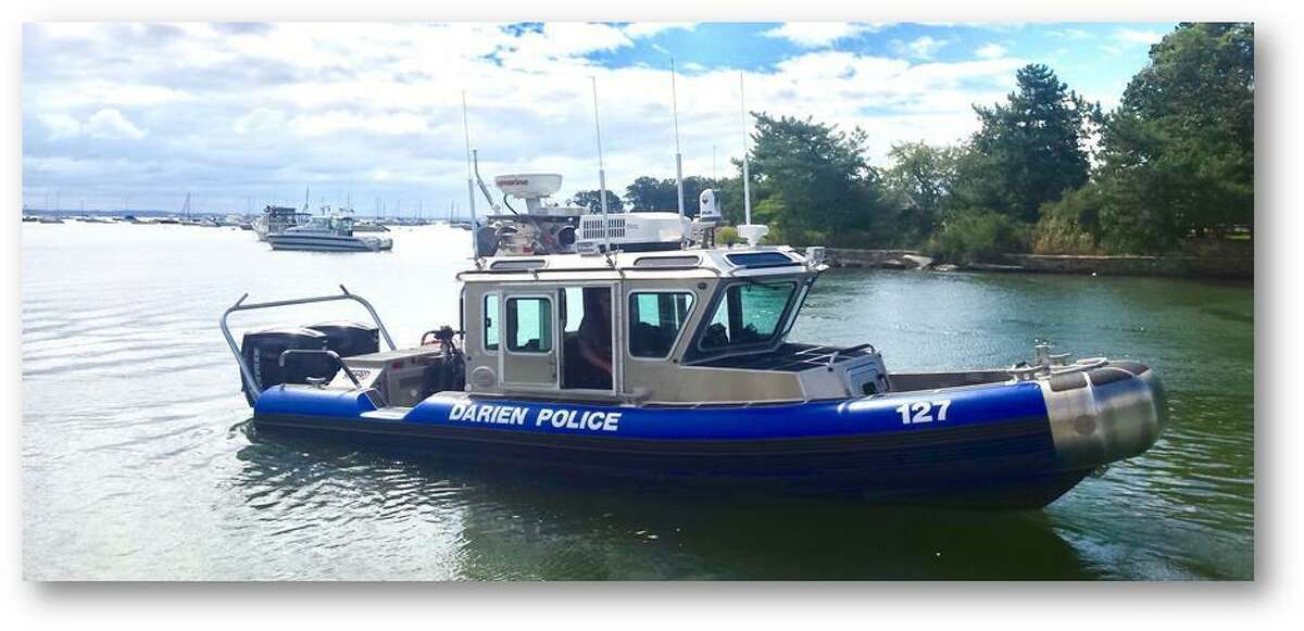 Darien Police rescued a capsized kayaker from the rough waters off Long Neck Point Friday morning.