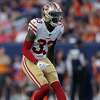 San Francisco 49ers safety Tarvarius Moore (33) tackles Kansas City Chiefs  wide receiver JuJu Smith-Schuster during an NFL football game in Santa  Clara, Calif., Sunday, Oct. 23, 2022. (AP Photo/Godofredo A. Vásquez