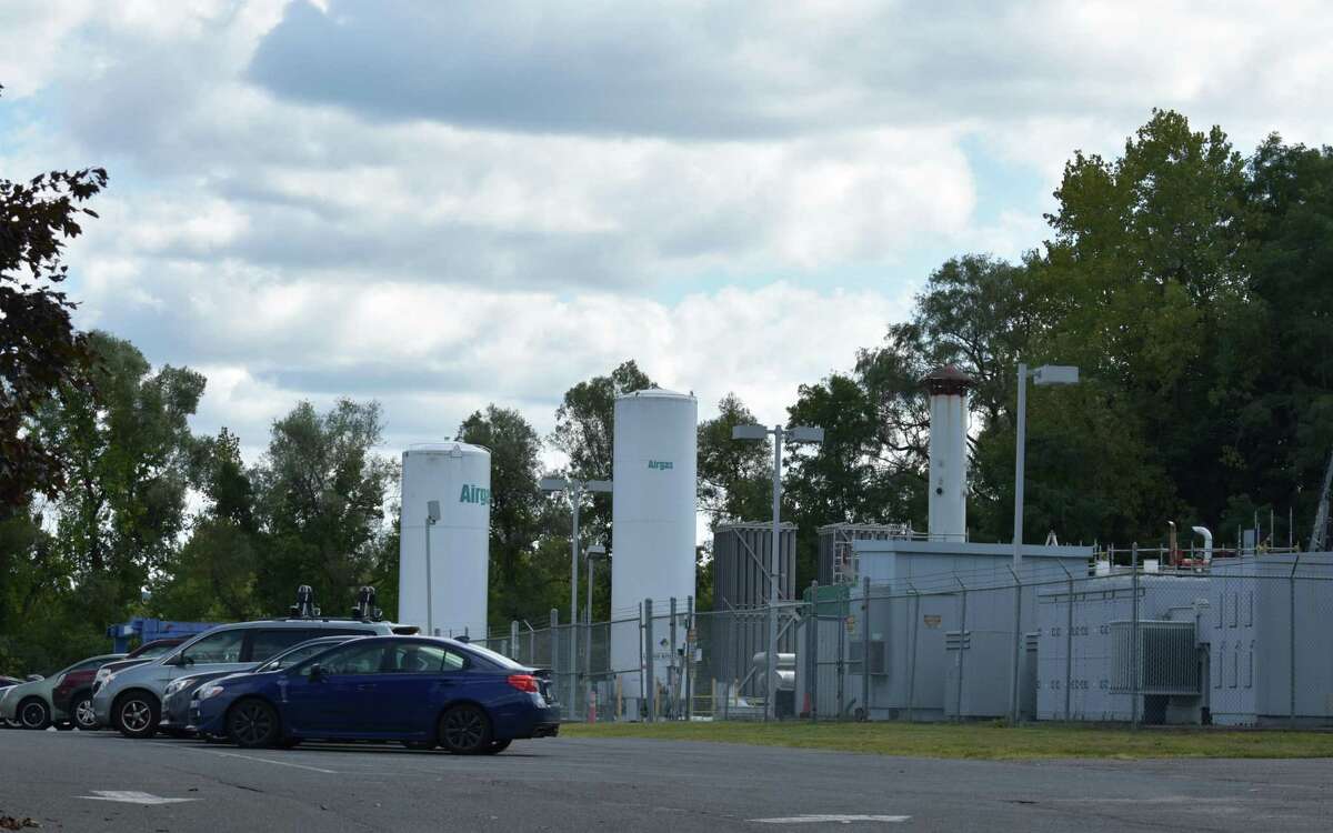 FuelCell Energy employee vehicles parked at the company's headquarters in Danbury, Conn., in September 2019. The company sold more than $14 million in stock to raise cash to pay down a loan on the cusp of going into default, buying new CEO Jason Few more time to put the company onto a stable financial footing.