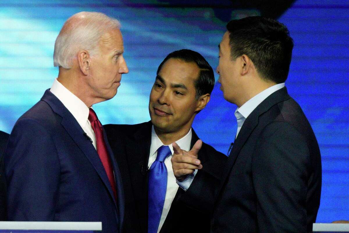 Democratic presidential candidates former Vice President Joe Biden, former Housing and Urban Development Secretary Julian Castro, and Andrew Yang talk Thursday, Sept. 12, 2019, after a Democratic presidential primary debate hosted by ABC at Texas Southern University in Houston.