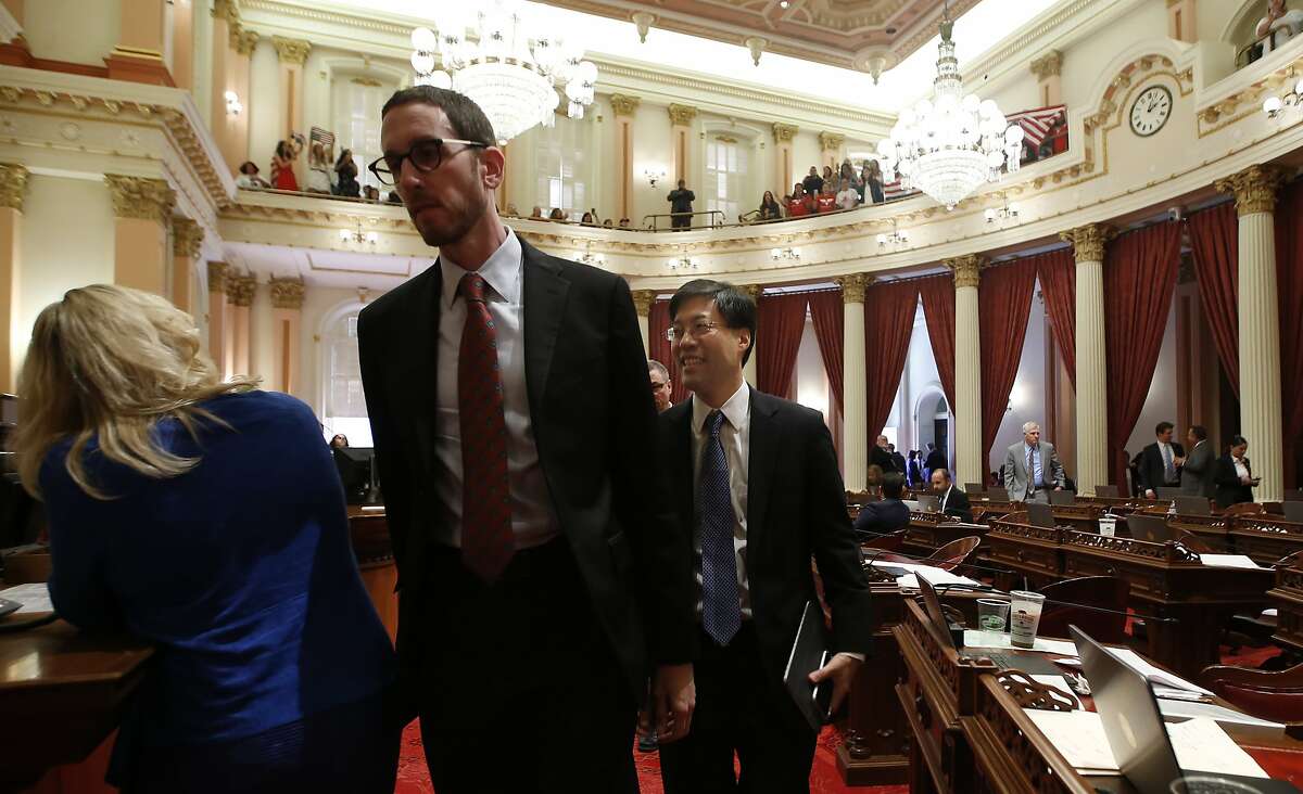 Members of the Senate leave the Senate Chambers as opponents of recently passed legislation, SB276, to tighten the rules on giving exemptions for vaccinations demonstrate in the gallery at the Capitol in Sacramento, on Sept. 9, 2019.
