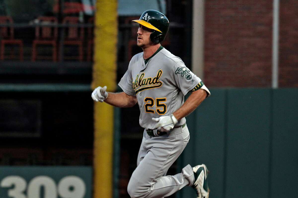 Stephen Piscotty (25) rounds the bases after hitting a solo homerun in the fifth inning as the San Francisco Giants played the Oakland Athletics at Oracle Park in San Francisco, Calif., on Tuesday, August 13, 2019.