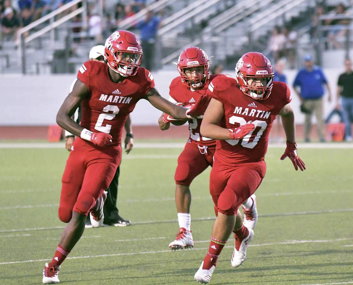 Jose Castañeda gets blocking from his teammates Dean Blondmonville and Octavio Alcorta as the Martin Tigers played the Cigarroa Toros Friday, September 13, 2019 at Shirley Field.