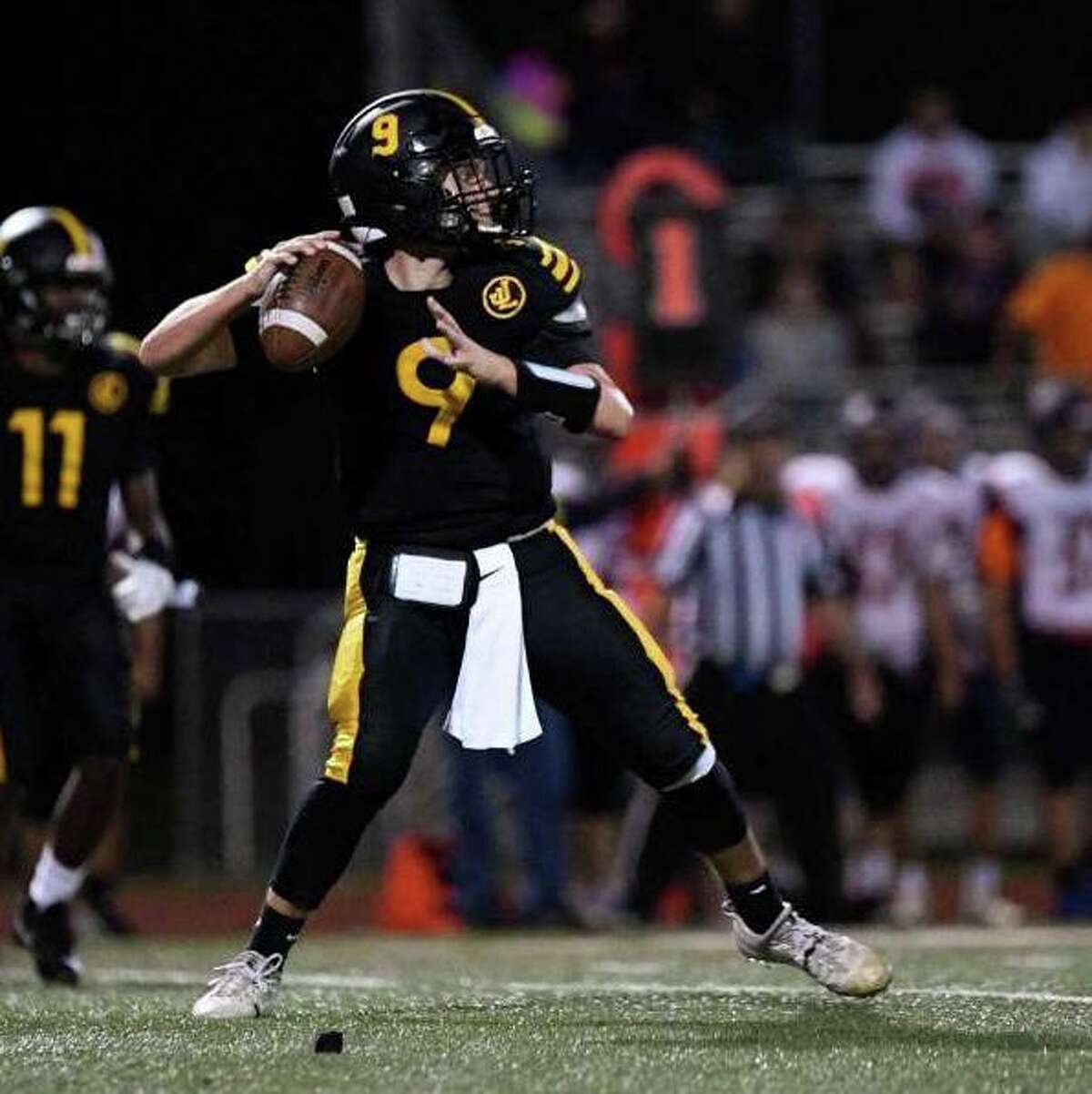 Mike Becker threw for four touchdowns for Law in its win over Lyman Hall.