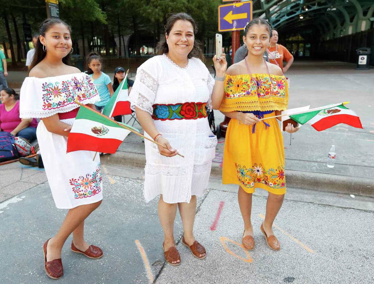 Parade-goers watch the Houston Fiestas Patrias Parade downtown, celebrating the Mexican Independence Day, Saturday, Sept. 14, 2019, in Houston.