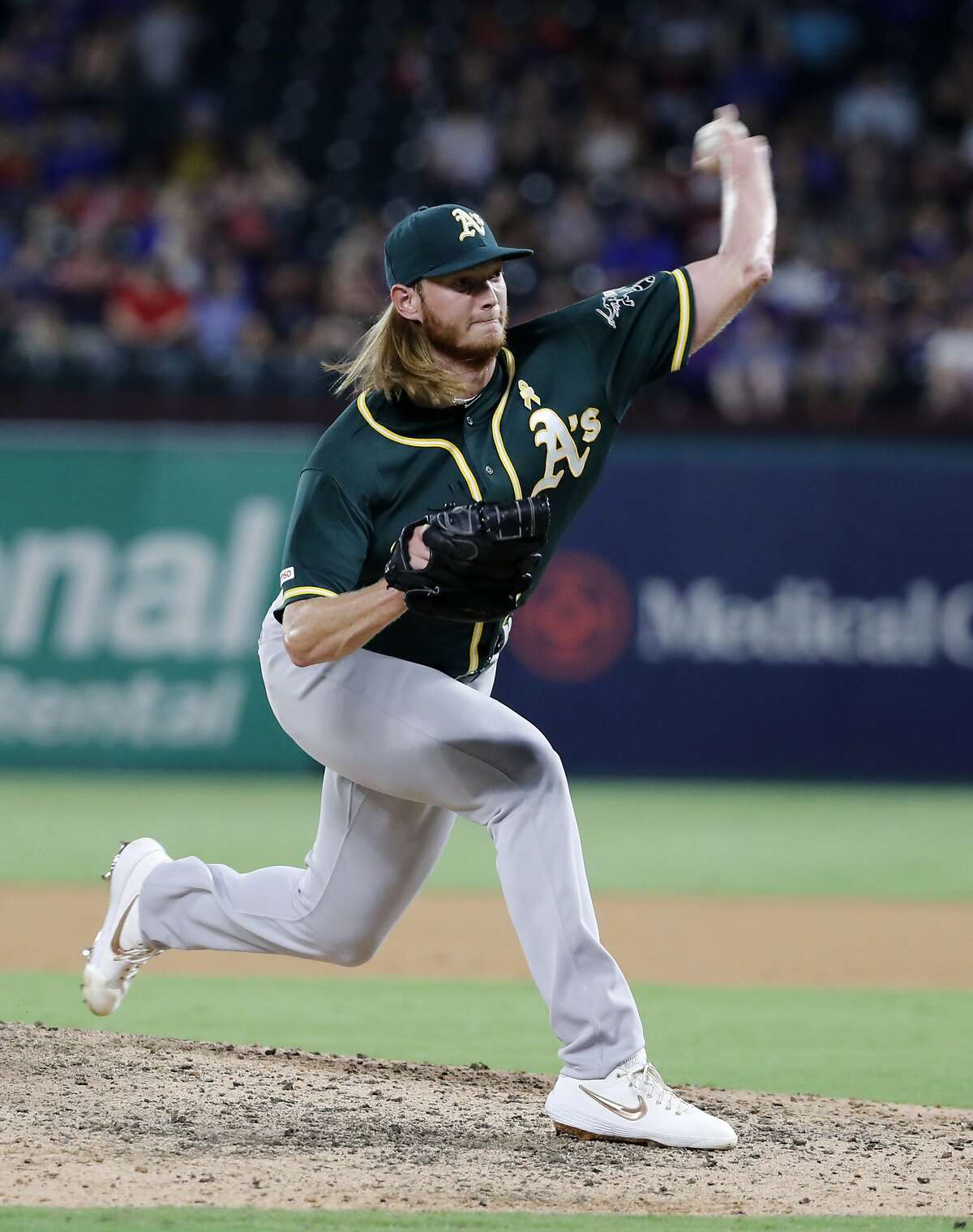 Oakland Athletics' A.J. Puk throws to a Texas Rangers batter during the seventh inning of a baseball game in Arlington, Texas, Friday, Sept. 13, 2019. (AP Photo/Tony Gutierrez)