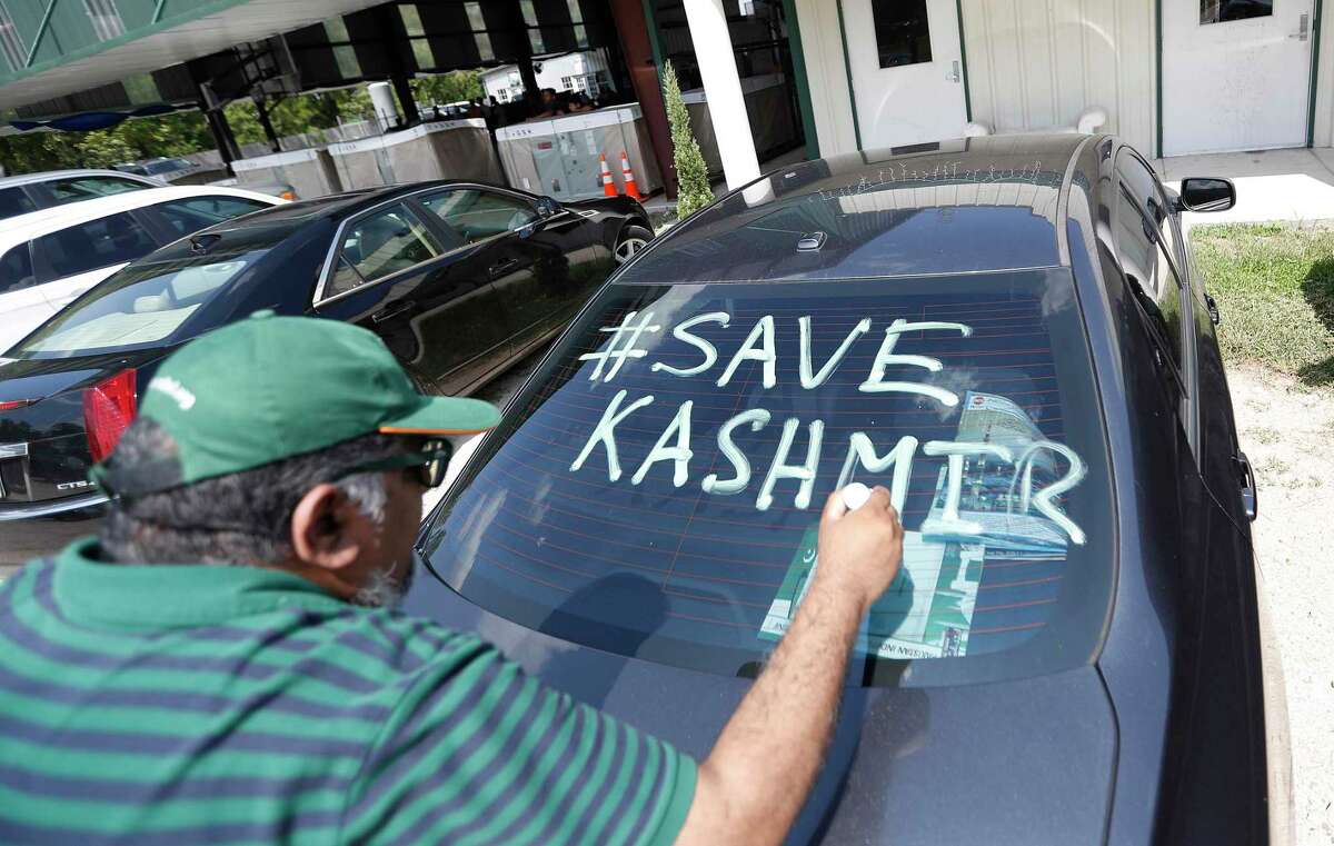 Ilyas Choudry writes #Save Kashmir on the window of a car that was to participate during a truck rally at the Sikh National Center Gurdwara, Saturday, Sept. 14, 2019, in Houston. The rally is organized by the national human rights organization Sikhs for Justice and Friends of Kashmir, comprising of Kashmiri and Sikh people who are protesting Prime Minister Modi and his forthcoming appearance on Sunday September 22nd at NSG stadium, where 30,000 demonstrators are expected to protest India’s actions in Kashmir and Punjab.