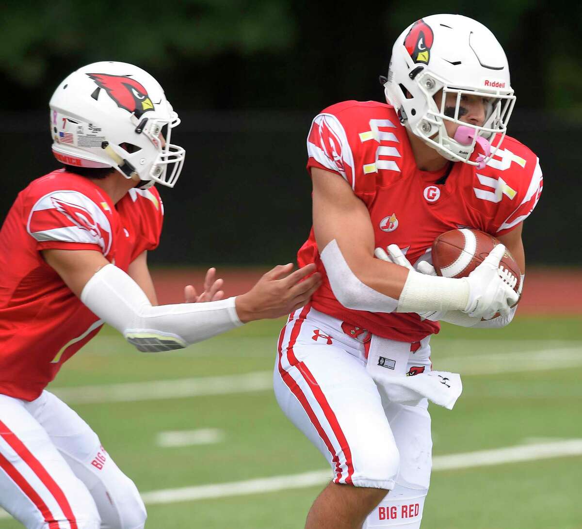 Greenwich’s Jack Warren (44) takes the handoff from quarterback James Rinello in the first quarter against Danbury in a FCIAC football game season-opener at Cardinal Stadium on Sept. 14, 2019 in Greenwich, Connecticut.