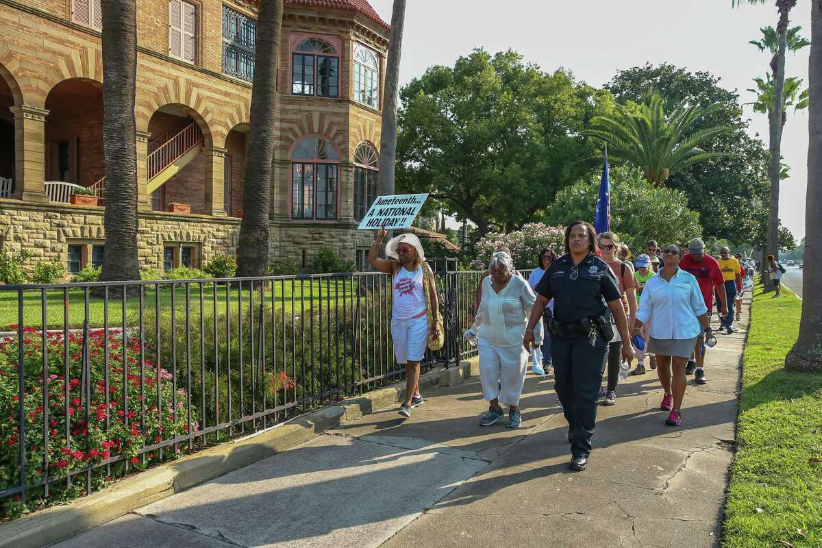 Ms. Opal Lee, 92, of Fort Worth leads a group of followers on her walking campaign for Juneteenth holiday awareness through the streets of Galveston Island, Texas on September 14, 2019.