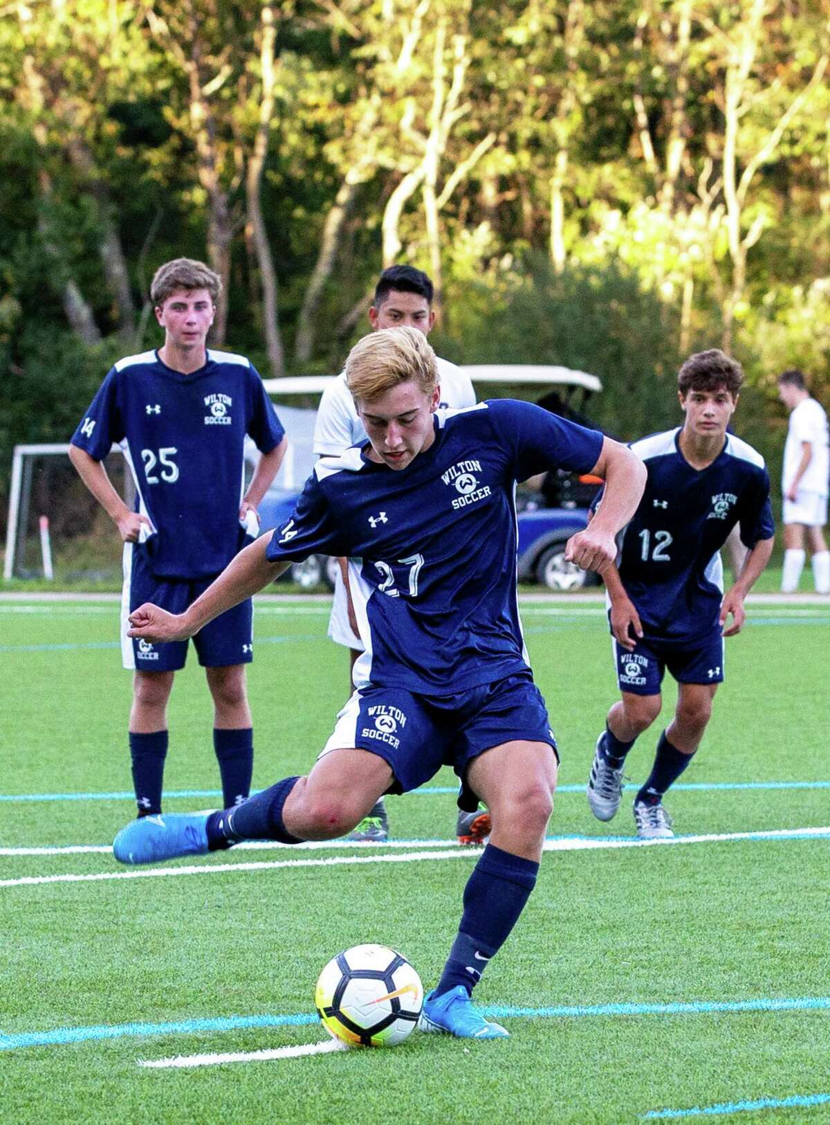 Will Hughes converts a penalty kick during Wilton's 6-1 win over St. Joseph.