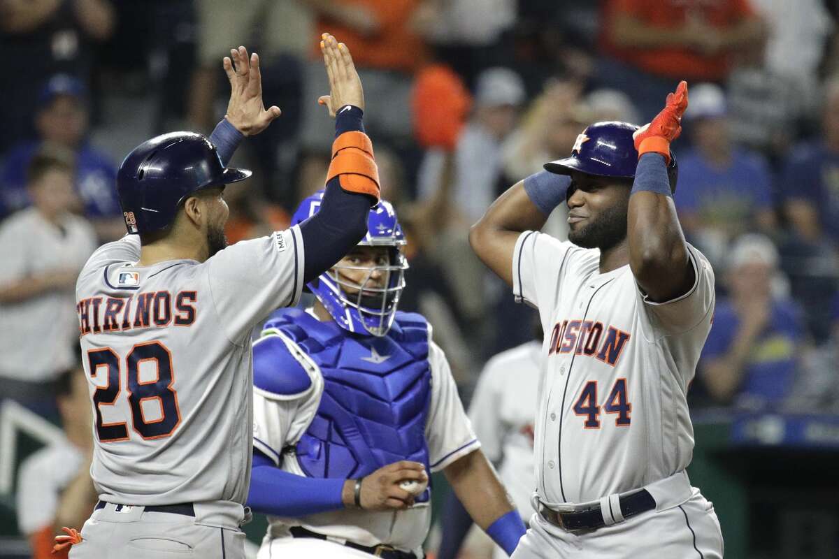 Houston Astros' Yordan Alvarez (44) celebrates with Robinson Chirinos (28) after hitting a three-run home run during the eighth inning of a baseball game against the Kansas City Royals on Saturday, Sept. 14, 2019, in Kansas City, Mo. (AP Photo/Charlie Riedel)