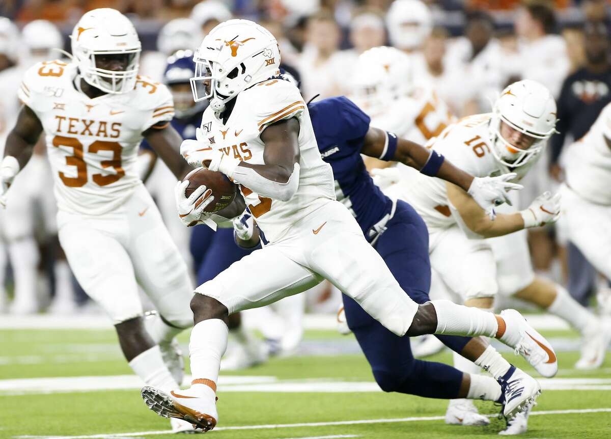Texas Longhorns defensive back D'Shawn Jamison (5) runs a kickoff for a touchdown in the fourth quarter against Rice University at NRG Stadium in Houston on Saturday, Sept. 14, 2019. Texas Longhorns won the game 48-13.