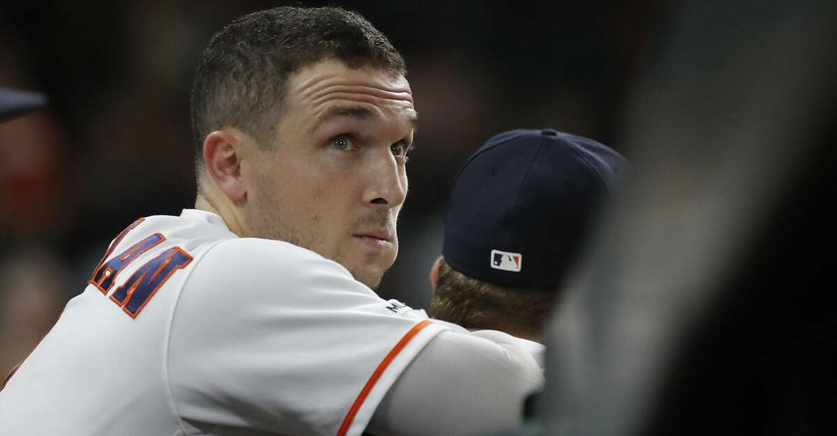 Houston Astros Alex Bregman (2) watches Yuli Gurriel (10) pinch hit in the seventh inning of a MLB baseball game at Minute Maid Park, Thursday, Sept. 12, 2019, in Houston.