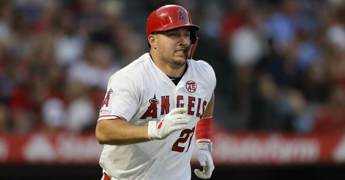 Los Angeles Angels' Mike Trout runs to first after a RBI-single against the Boston Red Sox during the second inning of a baseball game in Anaheim, Calif., Saturday, Aug. 31, 2019. (AP Photo/Chris Carlson)