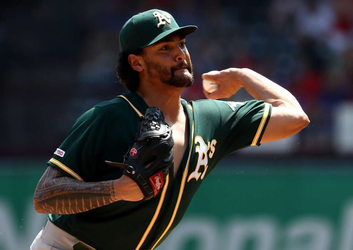 ARLINGTON, TEXAS - SEPTEMBER 15: Sean Manaea #55 of the Oakland Athletics throws against the Texas Rangers in the first inning at Globe Life Park in Arlington on September 15, 2019 in Arlington, Texas. (Photo by Ronald Martinez/Getty Images)