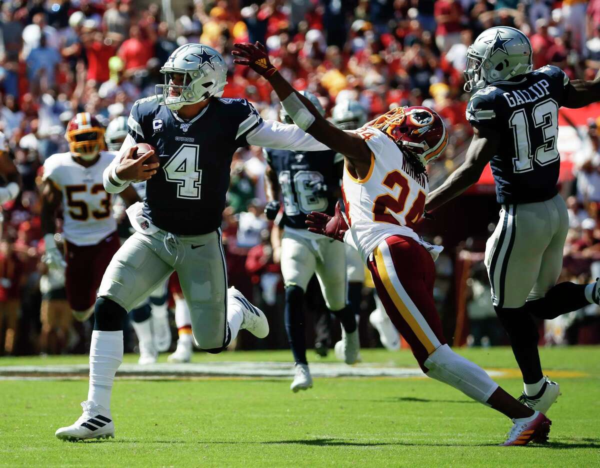 Dallas Cowboys quarterback Dak Prescott (4) runs during an NFL