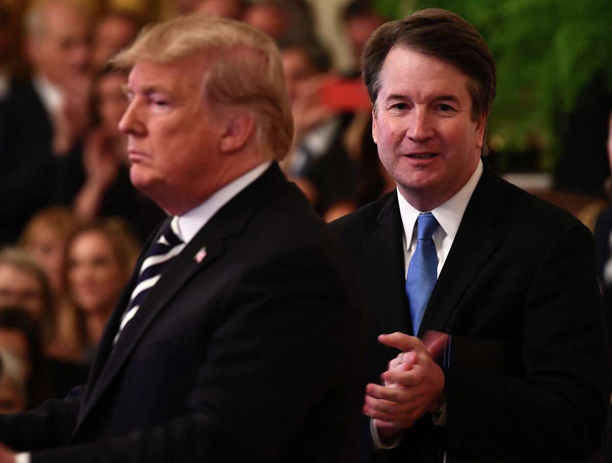 (FILES) In this file photo taken on October 08, 2018 US President Trump participates in the swearing-in ceremony of Brett Kavanaugh (R) as Associate Justice of the US Supreme Court at the White House in Washington, DC. - US President Donald Trump mounted an angry defense of Supreme Court Justice Brett Kavanaugh on September 15, 2019 as the controversial judge faced calls for an investigation over fresh allegations of sexual misconduct. Trump blasted the media and "Radical Left Democrats" after a former Yale classmate of Kavanaugh alleged that the jurist -- one of the most senior judges in the land -- exposed himself at a freshman year party before other students pushed his genitals into the hand of a female student.The latest allegation in the New York Times came after Kavanaugh denied sexual misconduct accusations leveled against him by two women during his confirmation to the Supreme Court last October. (Photo by Brendan Smialowski / AFP)BRENDAN SMIALOWSKI/AFP/Getty Images