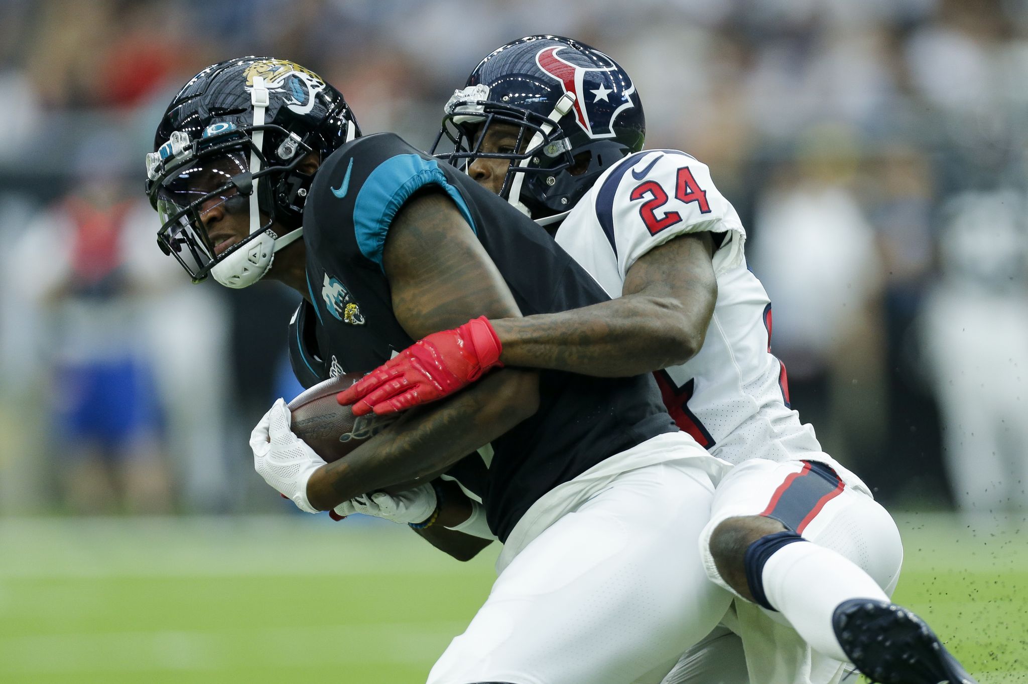 Houston Texans' J.J. Watt walks along the sideline in the first half of a  preseason NFL football game against the Dallas Cowboys in Arlington, Texas,  Saturday, Aug. 24, 2019. (AP Photo/Michael Ainsworth