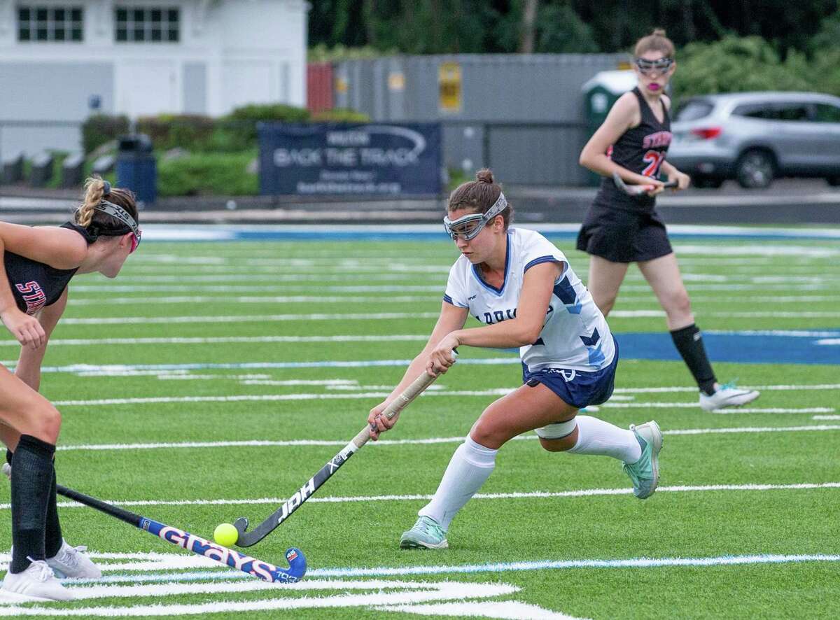 Olivia Hahn looks to get past a Stamford player in last week's season opener.