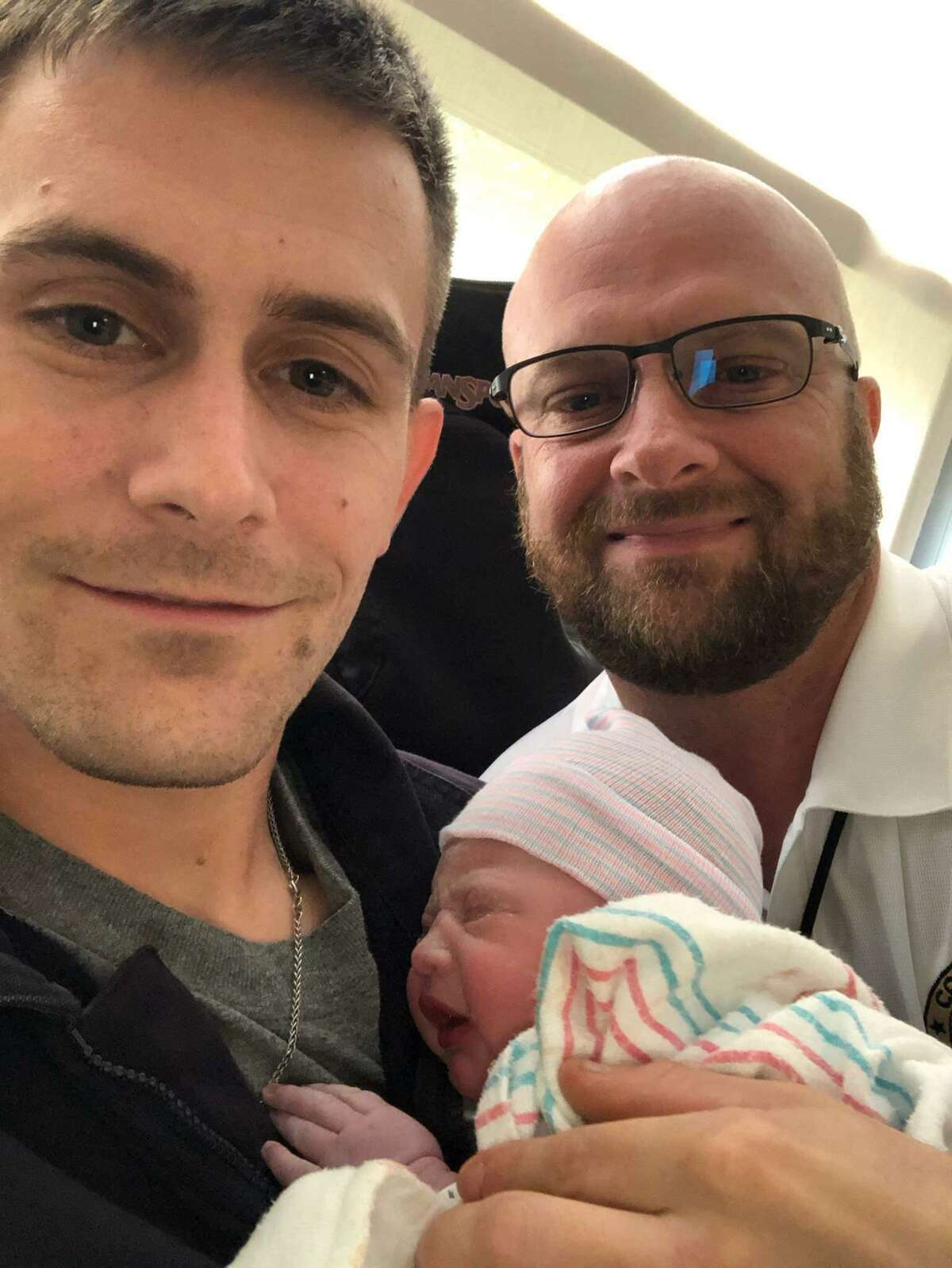 Brandon Hayden, left, and his father, Constable Kenneth "Rowdy" Hayden, pose for a picture with newborn Autumn Rene Hayden. The daughter of Brandon Hayden, she is Constable Hayden's first grandchild.
