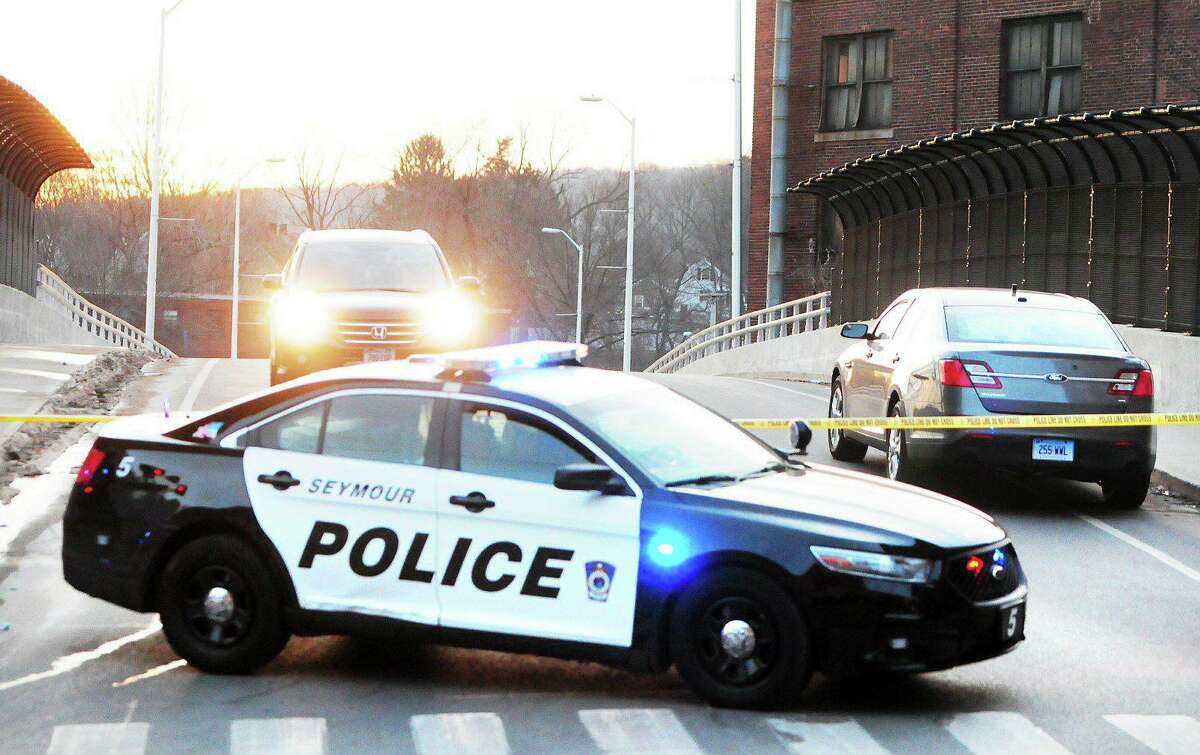 (Peter Hvizdak ? New Haven Register) Police close off Maple Ave. in Ansonia on 2/1/2014.