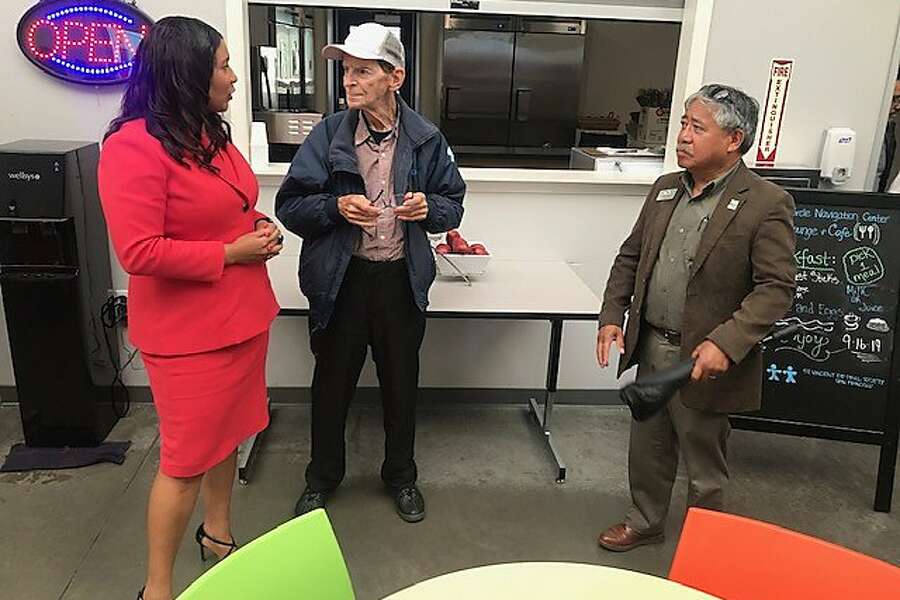 Mayor London Breed and Vallejo Mayor Bob Sampayan meet with Paul Forbes, who is staying at the Division Circle Navigation Center in the Mission District. The center added 60 new beds on Monday, Sept. 16, 2019.