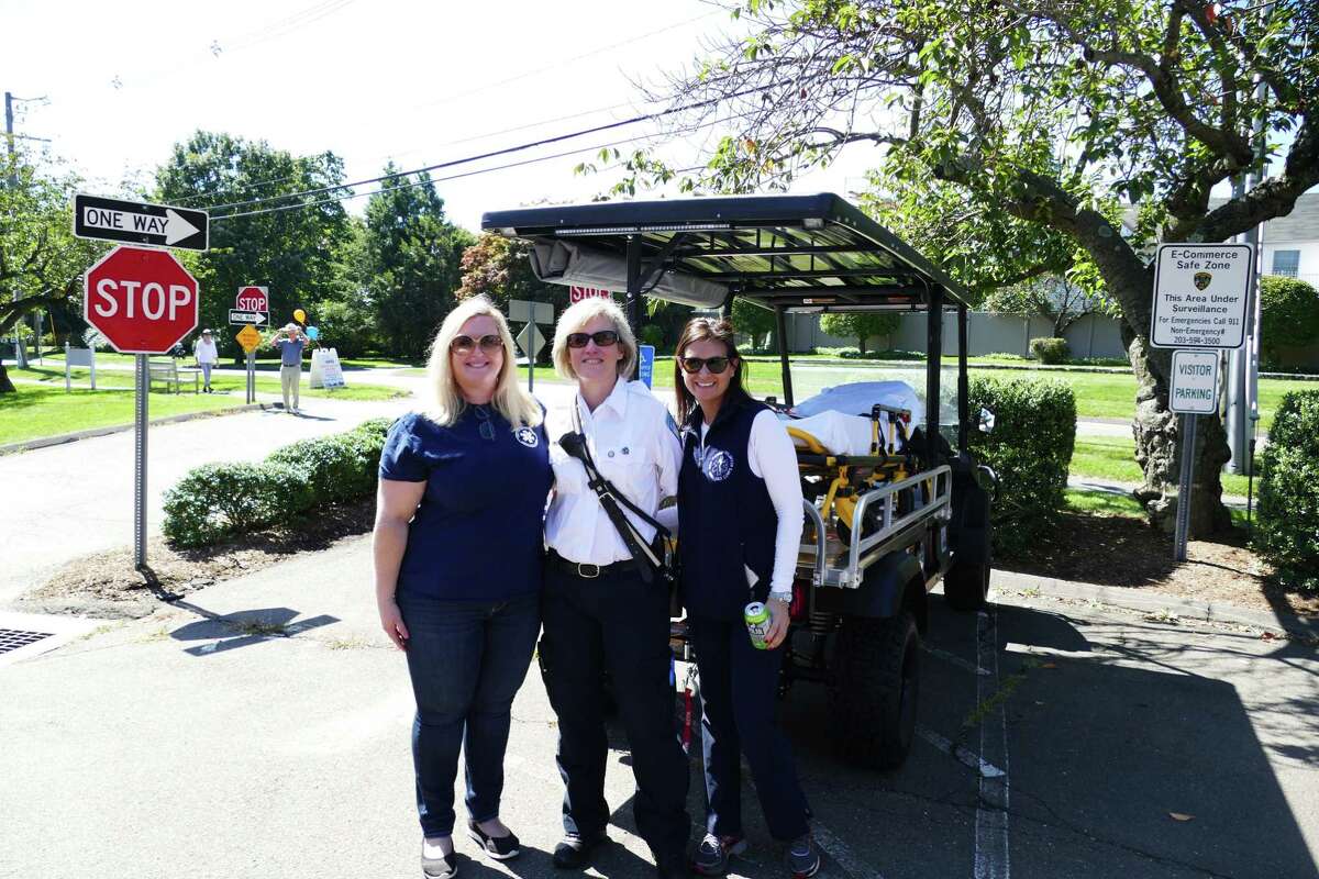 EMTs Kelly Daniel, Debbie Fasano and Niki Morton stood by a mobile stretcher at the EMS open house on Sunday, Sept. 15.